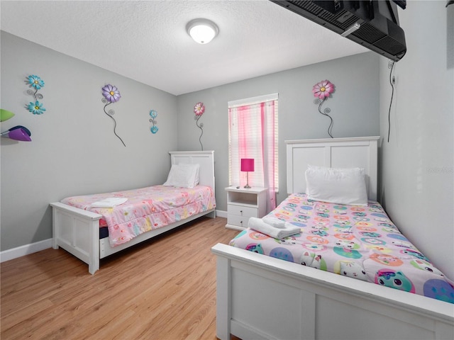 bedroom featuring light hardwood / wood-style flooring