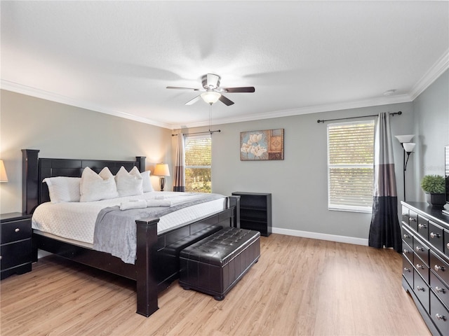 bedroom featuring ceiling fan, ornamental molding, and light hardwood / wood-style floors