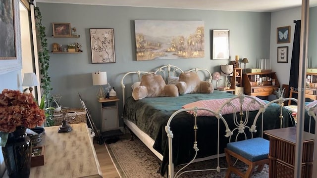 bedroom with wood-type flooring