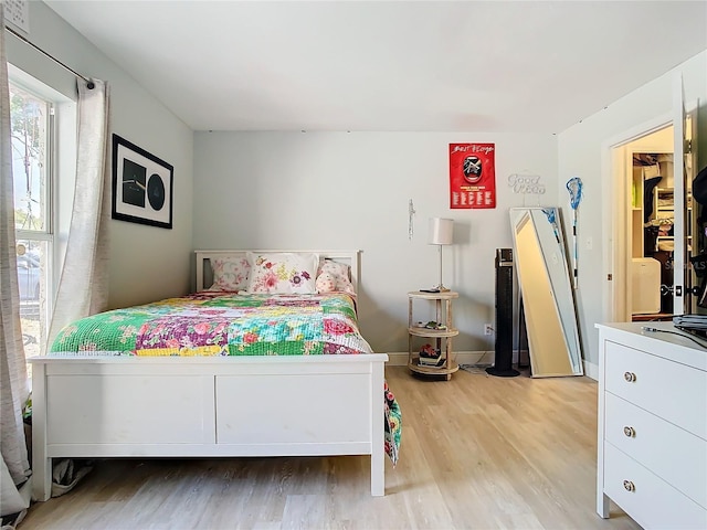 bedroom with hardwood / wood-style floors