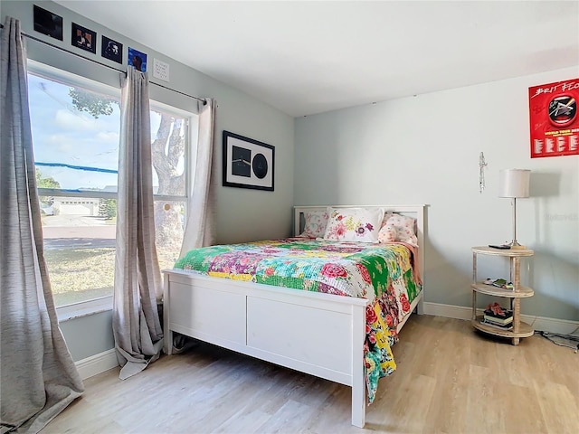 bedroom with hardwood / wood-style floors