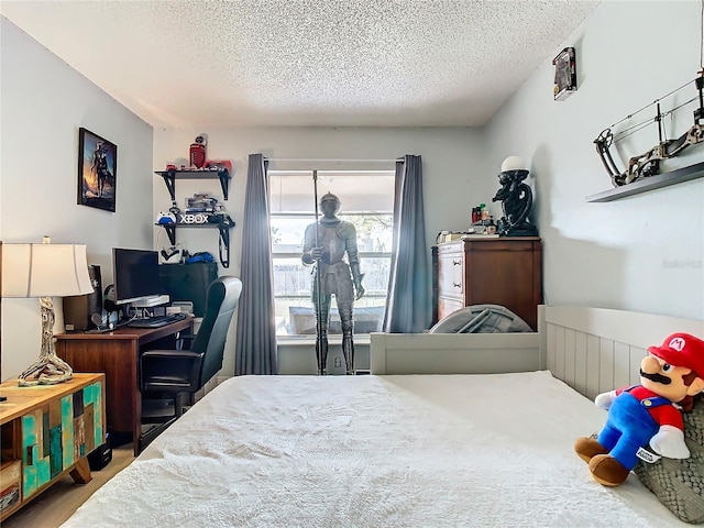 bedroom featuring a textured ceiling