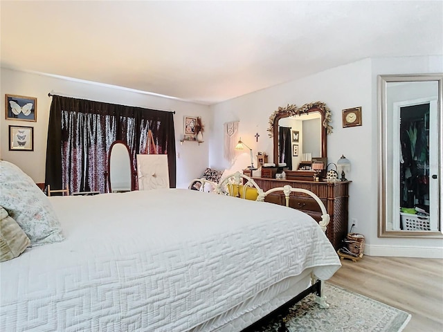 bedroom with wood-type flooring