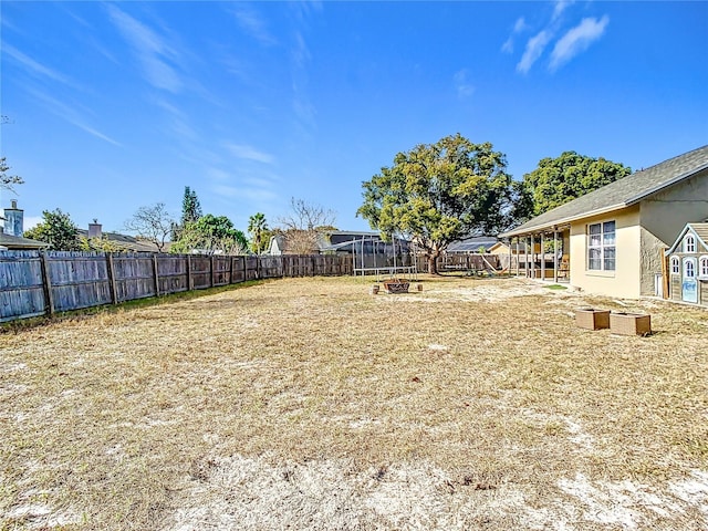 view of yard featuring a fire pit