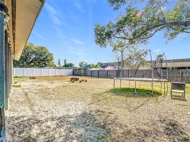 view of yard with a trampoline