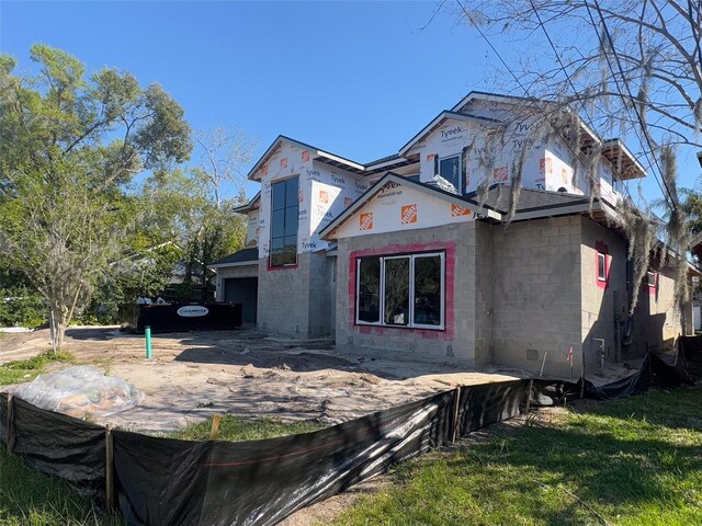 view of front of house with concrete block siding