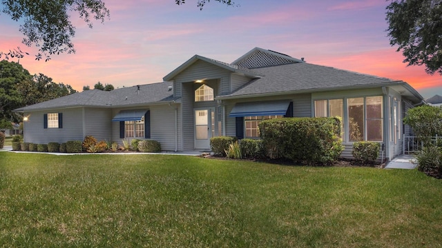 view of front of house with a lawn