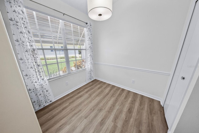 spare room with light wood-type flooring