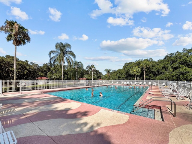 view of swimming pool featuring a patio area