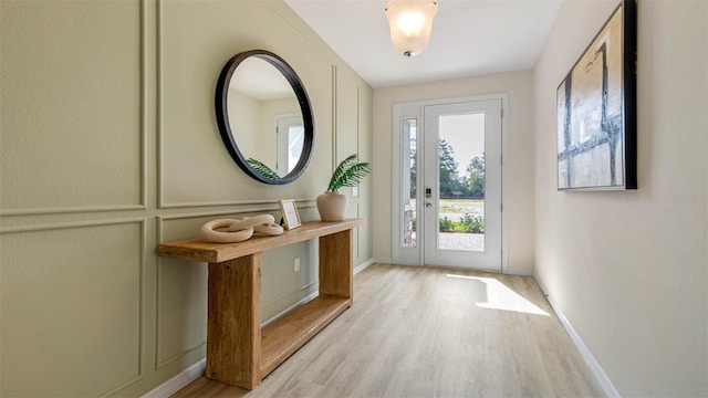 doorway to outside with light hardwood / wood-style floors