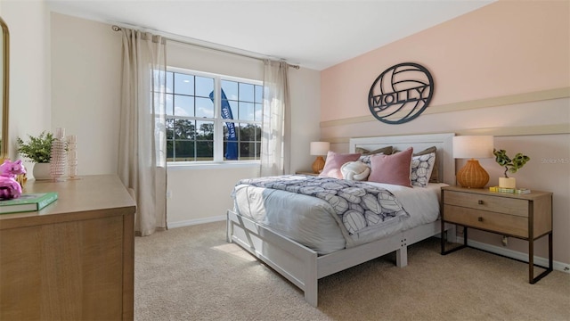 bedroom featuring light colored carpet