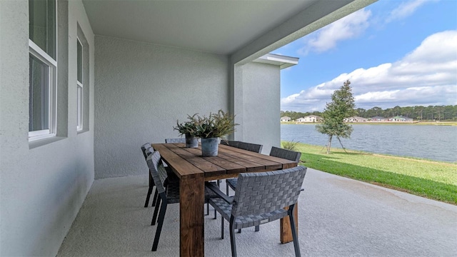 view of patio with a water view