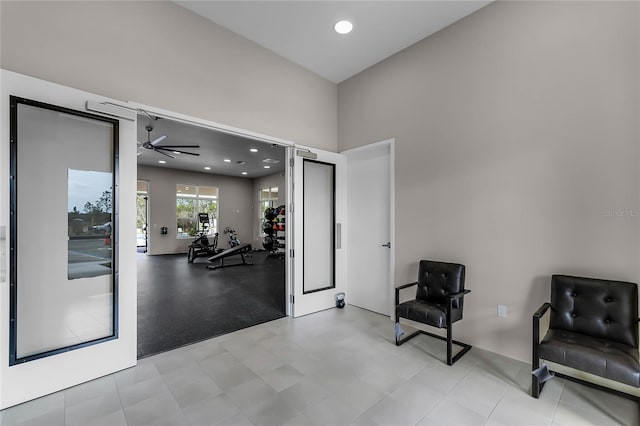 living area with ceiling fan