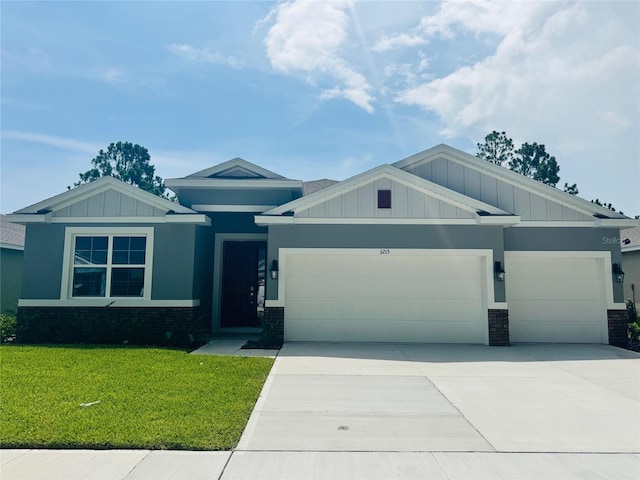 3221 Arch Ave, Ormond Beach, FL 32174 - craftsman-style home featuring board and batten siding, an attached garage, concrete driveway, and a front yard