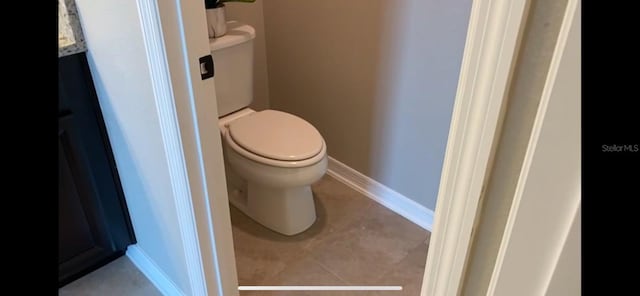 bathroom featuring tile patterned floors and toilet