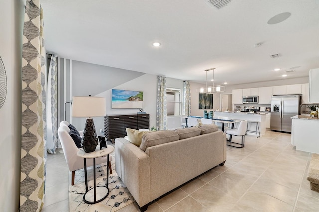 living room with light tile patterned floors