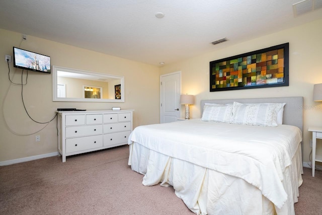 bedroom featuring light colored carpet