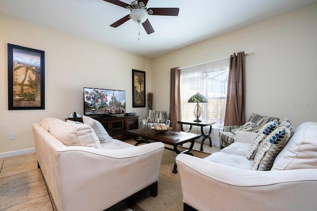 living room with ceiling fan and light tile patterned floors