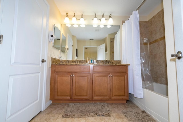 bathroom featuring tile patterned flooring, shower / bath combo, and vanity