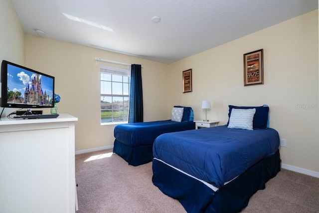 bedroom featuring light colored carpet