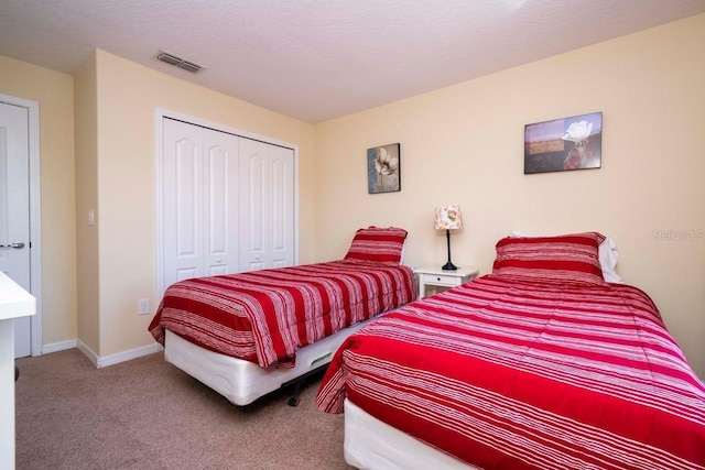 carpeted bedroom with a closet