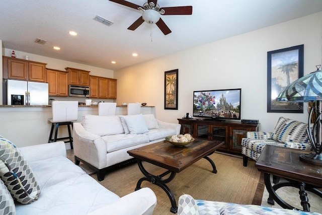 living room with ceiling fan