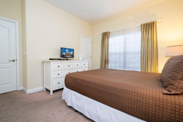 bedroom with light colored carpet