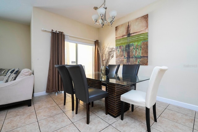 tiled dining space featuring a notable chandelier