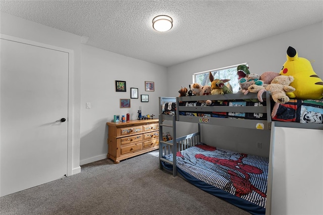 bedroom featuring a textured ceiling and carpet flooring