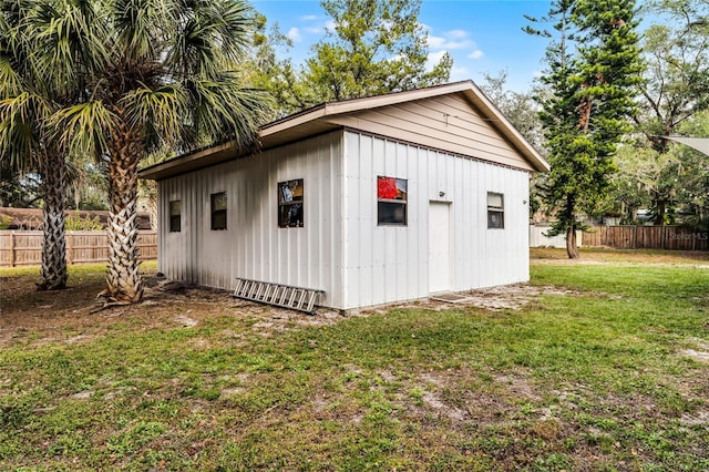 view of outbuilding with a yard