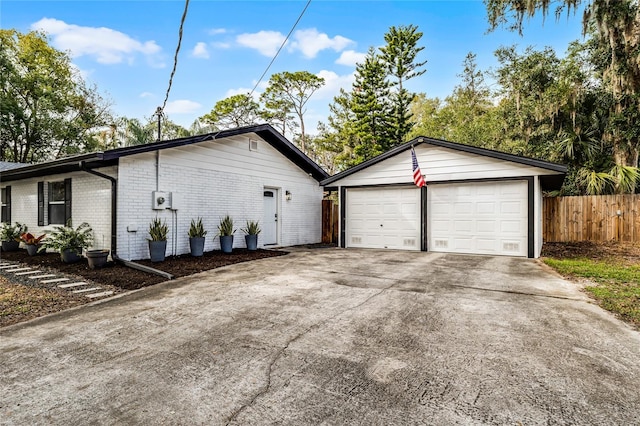 view of side of property featuring a garage and an outdoor structure