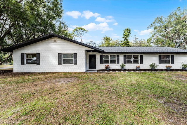 ranch-style house with a front yard