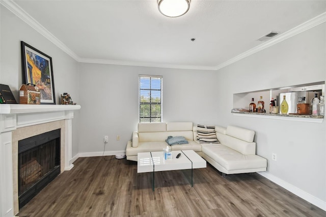 living room featuring dark wood-type flooring and crown molding