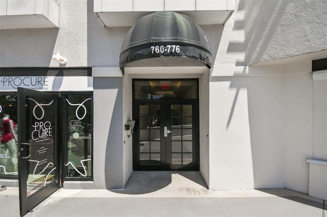 property entrance featuring french doors