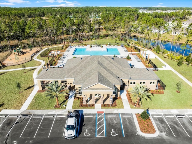 birds eye view of property with a water view