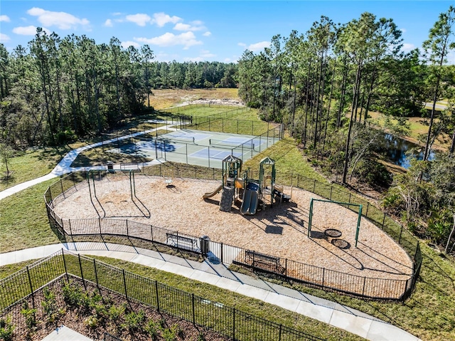 view of play area featuring a yard and a water view