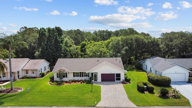 view of front facade featuring a garage and a front lawn