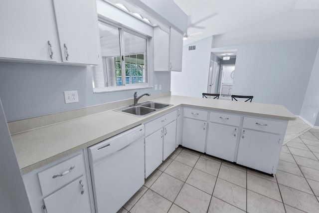 kitchen with sink, ceiling fan, white cabinetry, white dishwasher, and kitchen peninsula