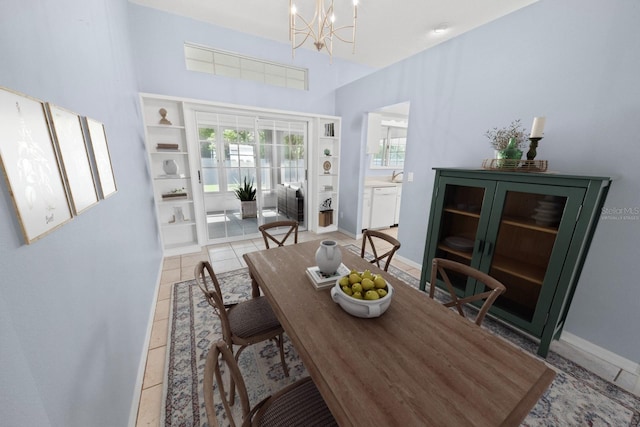 tiled dining area with a notable chandelier