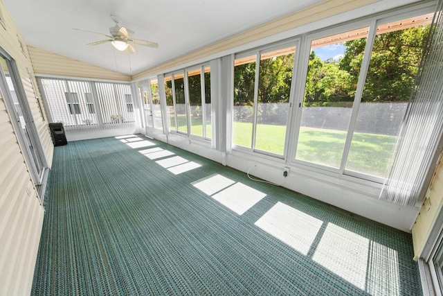 unfurnished sunroom featuring ceiling fan and lofted ceiling