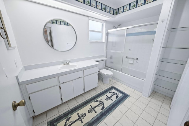 full bathroom with toilet, tile patterned floors, vanity, and shower / bath combination with glass door