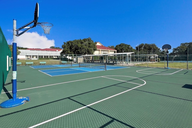 view of basketball court featuring tennis court