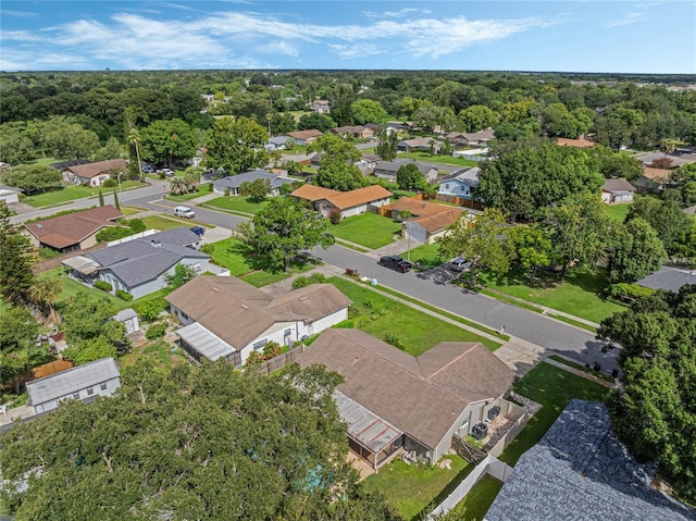 bird's eye view with a residential view and a wooded view