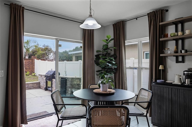 dining space featuring light tile patterned flooring