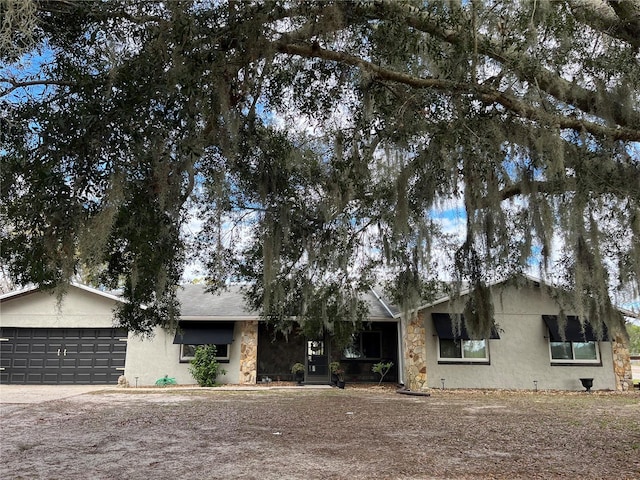 single story home featuring a garage