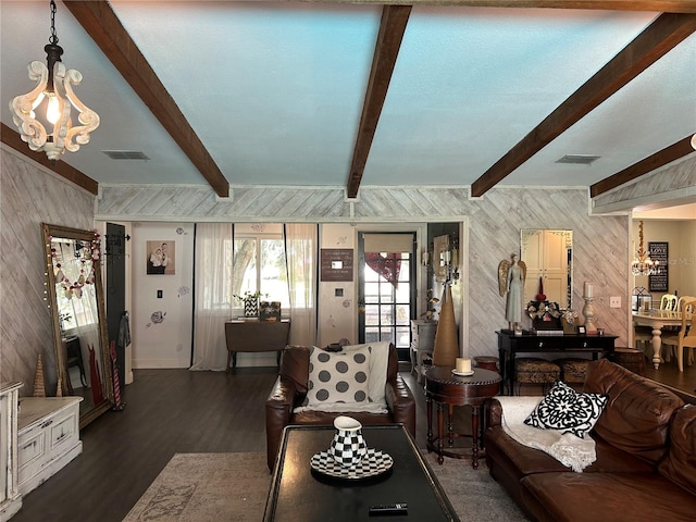 living room with beamed ceiling, dark hardwood / wood-style floors, and a notable chandelier