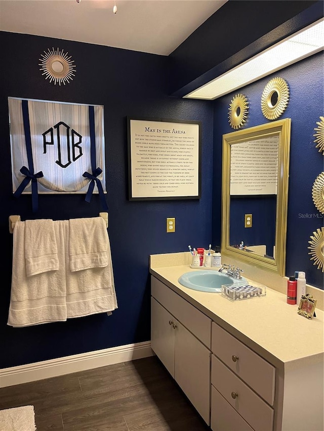 bathroom with vanity and hardwood / wood-style floors