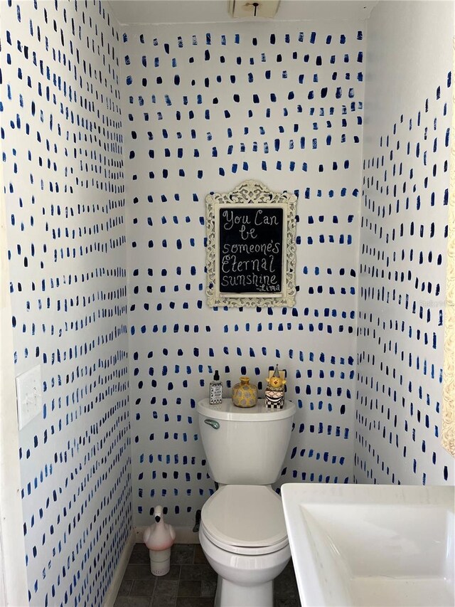 bathroom featuring tile patterned floors and toilet