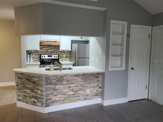 kitchen with kitchen peninsula, sink, white cabinetry, range hood, and stainless steel appliances