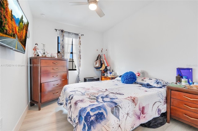 bedroom with ceiling fan and light hardwood / wood-style flooring